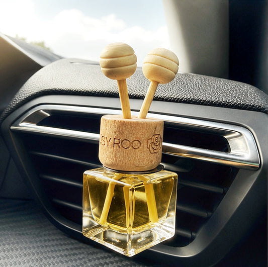 Citrus car diffuser in clipped into car vent.